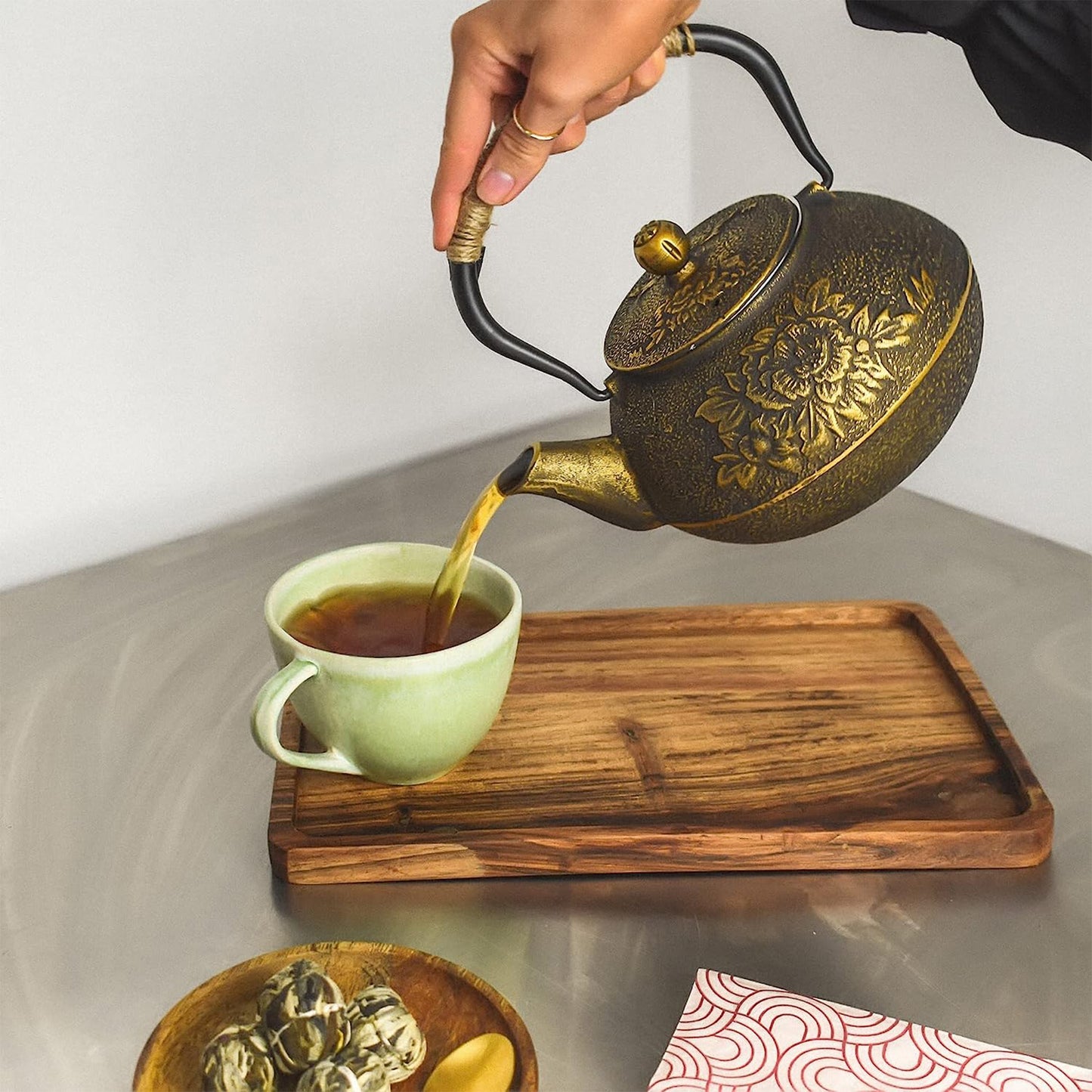 Traditional cast iron black and gold teapot